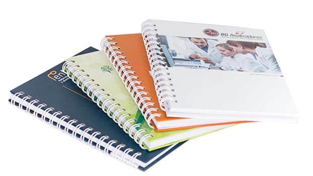 Cuadernos anillados corporativos con tapa personalizada, desarrollados para BG Analizadores.